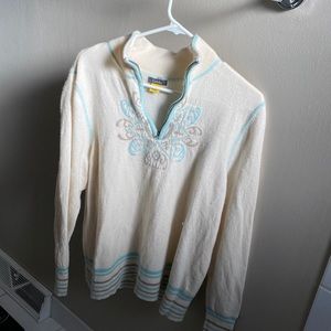 White and teal sweater